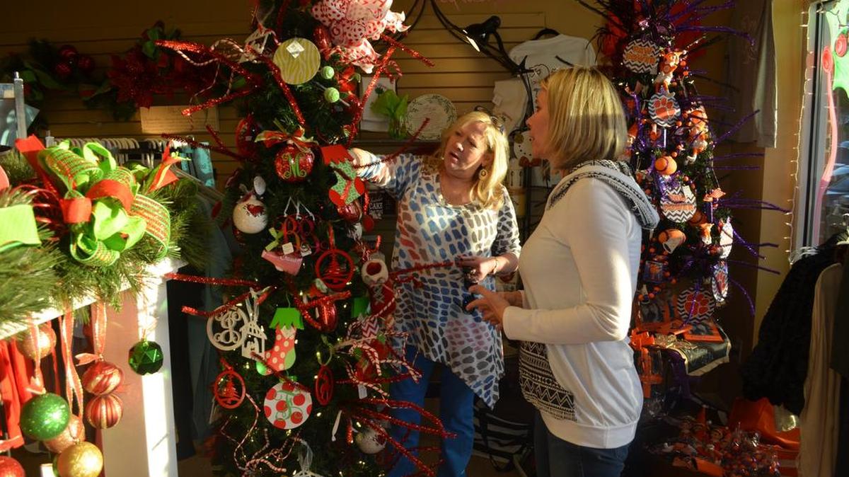 Brenda Hallman, right, helps Beth Simpson look for ornaments during a recent trip to Two Social Butterflies in Rock Hill. Hallman said she likes to shop local, but will be one of the many shoppers nationwide who likely will not shop on Thanksgiving or Black Friday.
