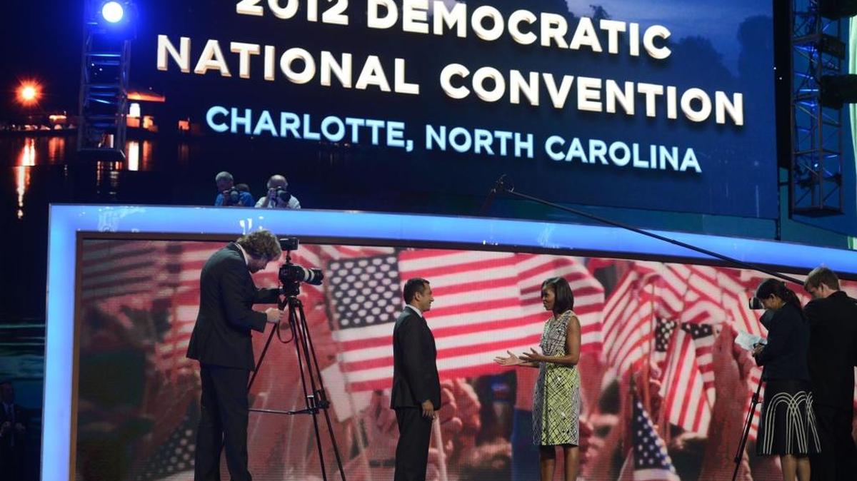 Kal Penn interviews First Lady Michelle Obama on the stage at Time Warner Cable Arena Monday at the 2012 Democratic National Convention in Charlotte.