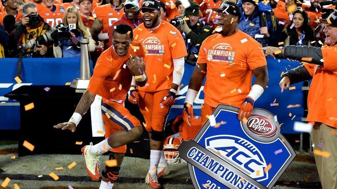 Clemson Tiger quarterback Deshaun Watson, left, strikes a Heisman pose after he and his teammates defeated North Carolina 45-37 in the 2015 Dr. Pepper ACC Football Championship game at Bank of America Stadium.