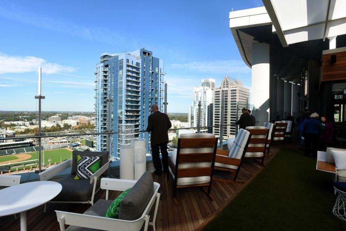 People take a tour of the rooftop bar at the Kimpton Tryon Park Hotel in the new 300 South Tryon building.