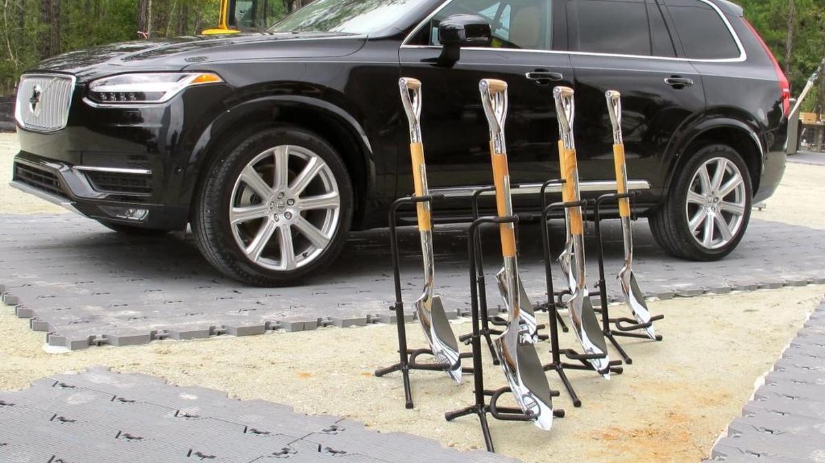 
A Volvo and shovels are displayed at the ground breaking for Volvo's first auto assembly plant in North America on Friday near Ridgeville, S.C. The company announced that the $500 million plant will make its new S60 sedan, which is currently under development in Sweden. The first cars are expected to roll off the assembly line in 2018. 
