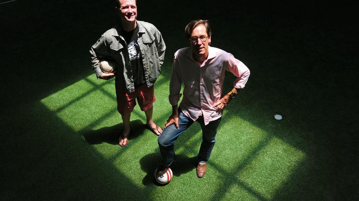 Entrepreneurs Mac Lackey (right) and Ross Saldarini founded soccer firm Kyck in 2011. Lately, Lackey has focused on promoting Charlotte as an international soccer hub.