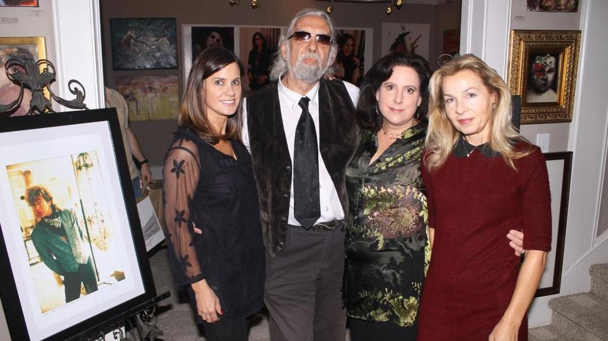 In this 2013 file photo, Allison Sprock, Barcelona-based rock photographer Martin Frias, Atlanta-based photographer Emily Robinson Cook and curator Zoya Conover get ready to meet guests at Frias and Cook’s exhibit at Allison Sprock Fine Art. Frias is famous for photographing his friends including Salvador Dali, Robert Plant, David Bowie and Freddie Mercury.