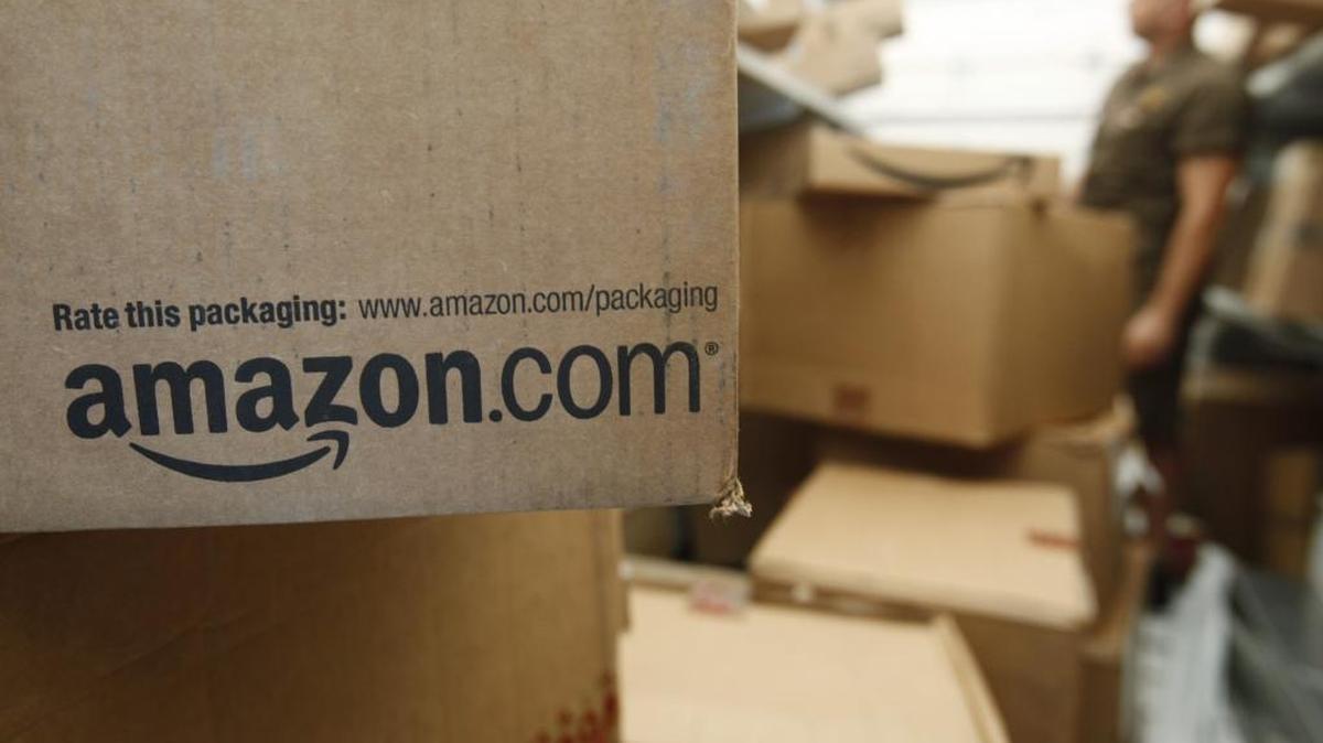 This Oct. 18, 2010 file photo shows an Amazon.com package on a UPS truck in Palo Alto, Calif. (AP Photo/Paul Sakuma, File)