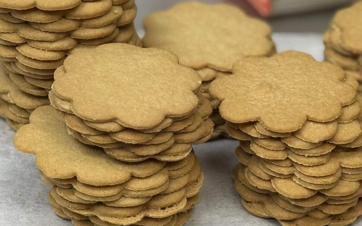 Piles of sugar cookies wait to be packed at Mrs. Hanes’ Moravian Cookies.
