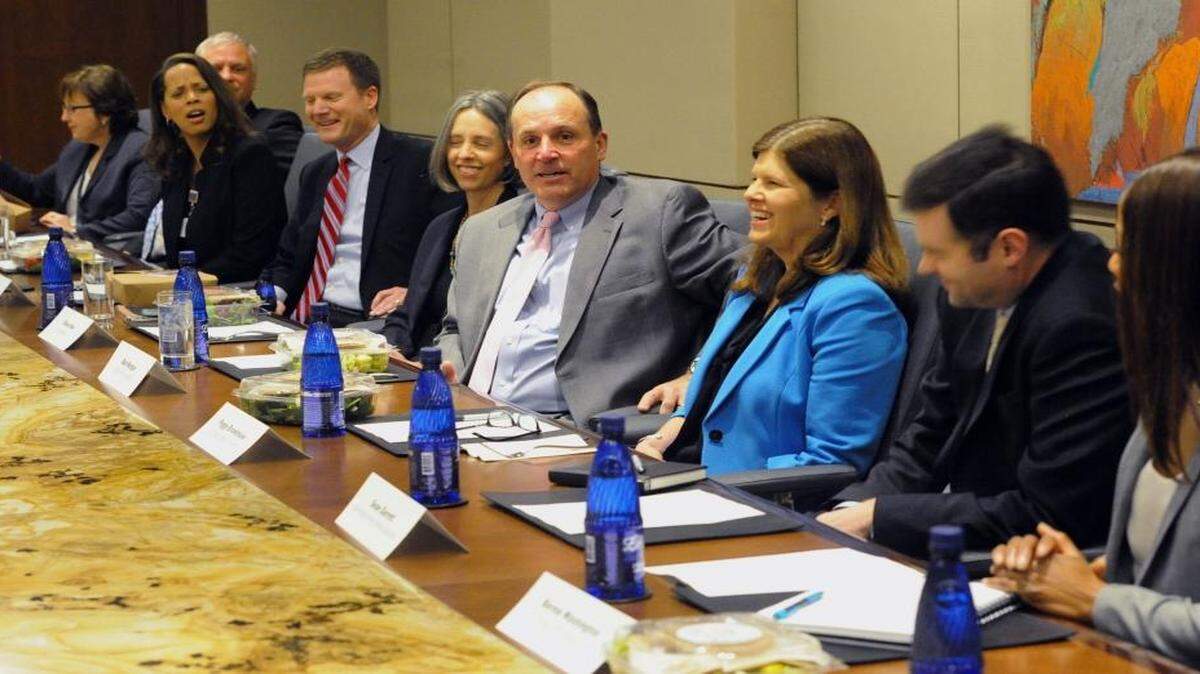 Participants share a laugh as Bob Morgan, center, of the Charlotte Chamber relates a story during the first meeting of the Charlotte Will initiative at Foundation for the Carolinas on Tuesday.