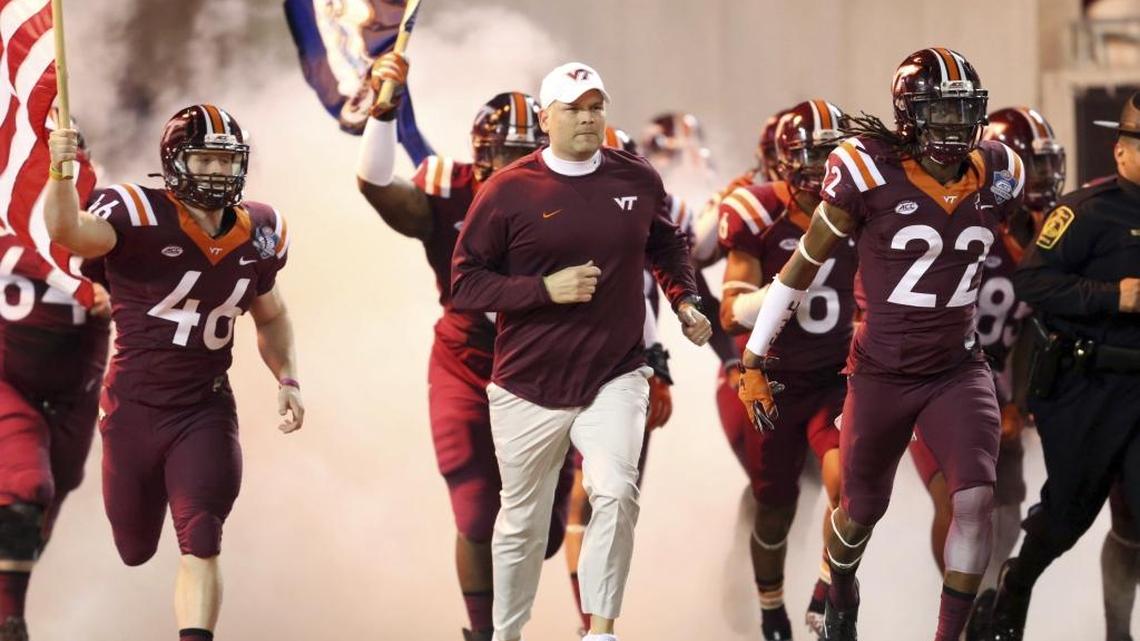 Virginia Tech head coach Justin Fuente enters the field before the first half of the Atlantic Coast Conference championship NCAA college football game against Clemson, on Dec. 3, 2016, in Orlando, Fla.