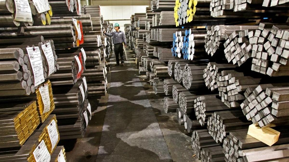Edwin Garcia, production supervisor, looks over finished orders of steel waiting to be shipped, January 4, 2011, at the Nucor Cold Finish Group plant in Oak Creek, Wisconsin.