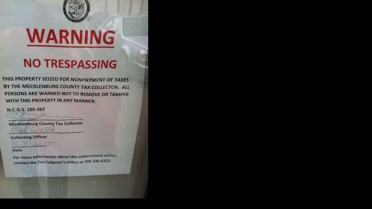 
A notice taped to the door of Webber Dentistry on Fairview Road told customers that the business was seized because of unpaid taxes.
