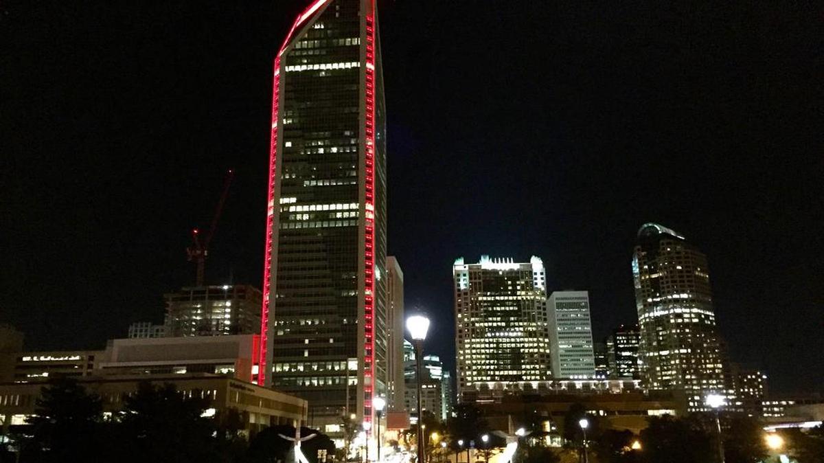Lights from the Duke Energy Center illuminates the uptown Charlotte evening skyline on October 30, 2015. Duke is seeking final approval of its Piedmont Natural Gas acquisition.