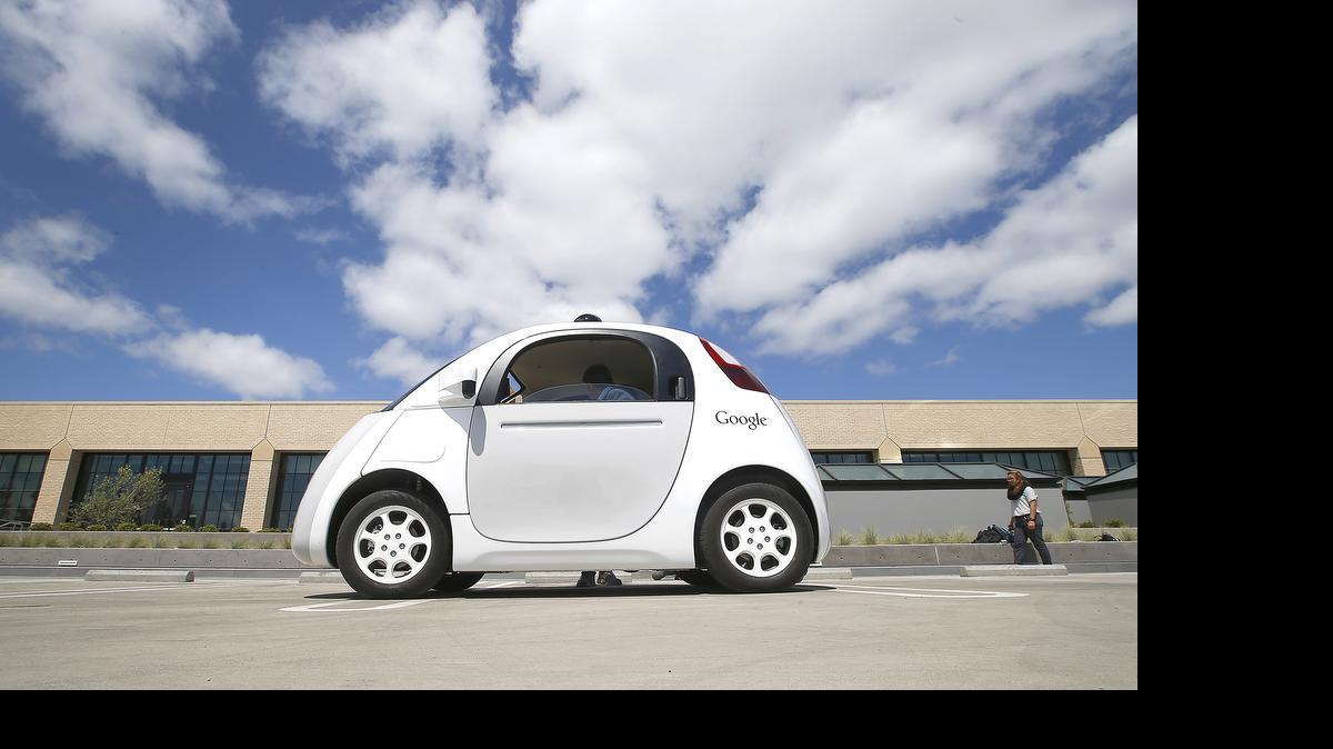 
Google's new self-driving prototype car is presented during a demonstration at the Google campus in Mountain View, Calif., this week. The car, which needs no gas pedal or steering wheel, will make its debut on public roads this summer. 
