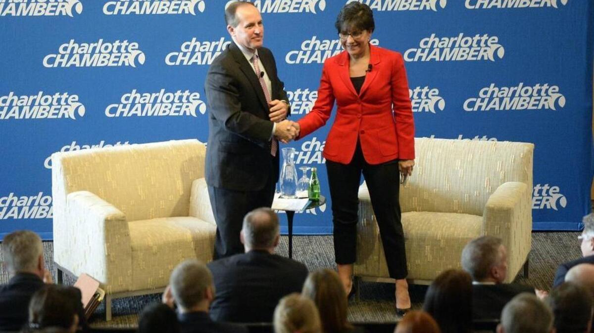 Charlotte Chamber CEO Bob Morgan shakes hands and thanks U.S. Commerce Secretary Penny Pritzker after an armchair discussion in the auditorium of UNC Charlotte Center City in 2015.