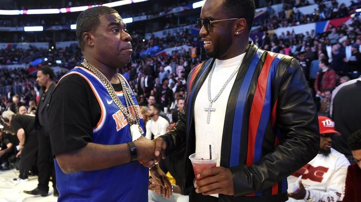 Actor and comedian Tracy Morgan, left, and singer Sean Combs talk during halftime of an NBA All-Star basketball game Feb. 18, 2018, in Los Angeles. Charlotte is already preparing to host the 2019 NBA All-Star Game, which will take place at the Spectrum Center uptown.