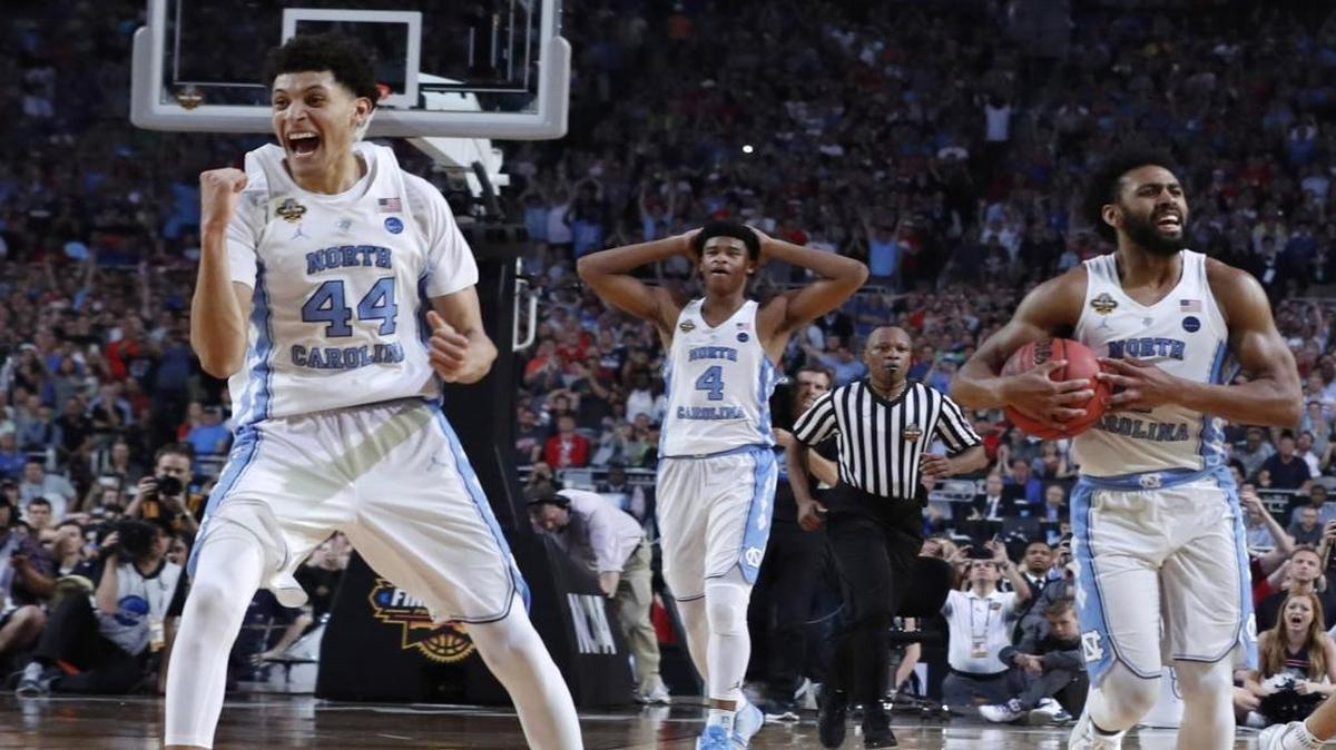North Carolina's Justin Jackson (44), Isaiah Hicks (4) and Joel Berry II (2) celebrate with 7 seconds left in UNC’s 2017 NCAA men’s basketball title win over Gonzaga at University of Phoenix Stadium in Glendale, Ariz., on April 3.