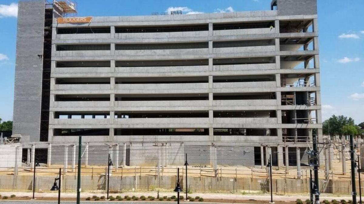 The parking deck near First Ward Park, which is expected to open now in early spring 2018. Levine Properties says steel-and-concrete framed apartments will now wrap the deck, instead of a wood-framed building that had been planned.