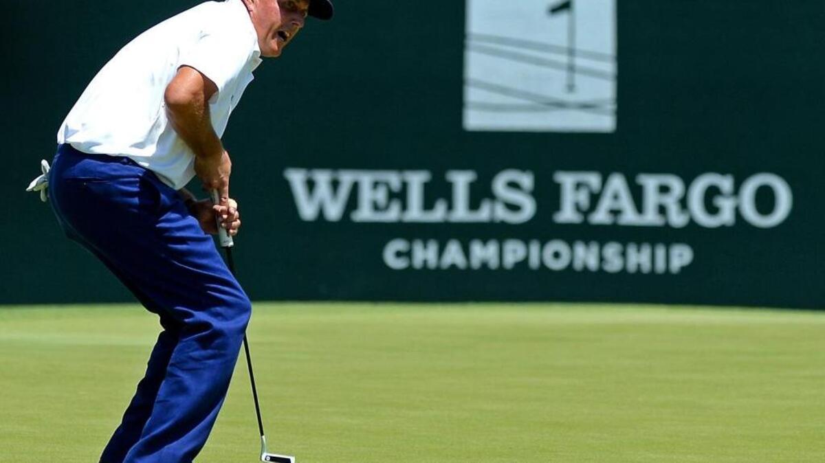 Phil Mickelson reacts to a missed putt on the third green during the Wells Fargo Championship in 2016 at Quail Hollow Club in Charlotte.