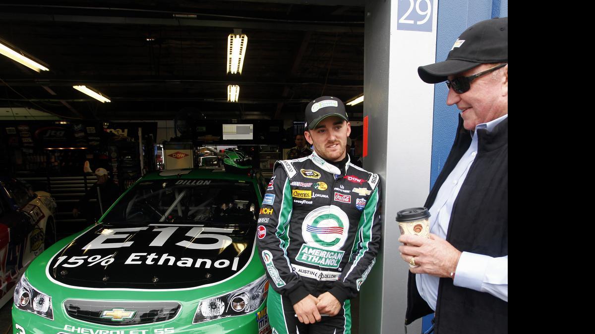 
Austin Dillon, driver of the #3 American Ethanol Chevrolet, stands in the garage area with Richard Childress, owner of Richard Childress Racing during practice for the NASCAR Sprint Cup Series Quicken Loans 400 at Michigan International Speedway on June 13, 2015 in Brooklyn, Michigan. 
