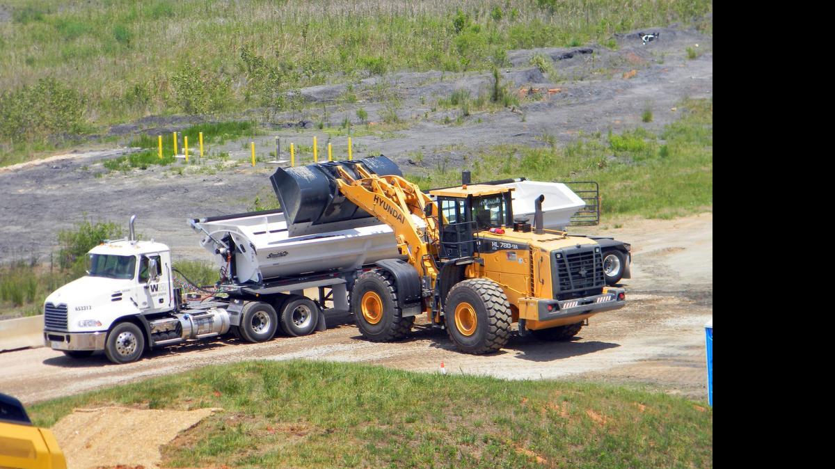 
A truck hauls away excavated coal ash from Duke Energy’s Riverbend power plant near Charlotte.
