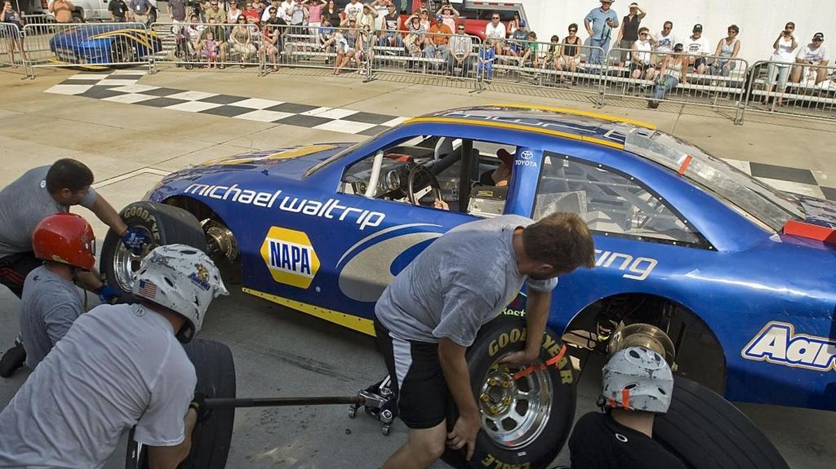 
The pit crew for Martin Truex Jr., the NAPA 56 car, give a pit stop demonstration for the fans during the Michael Waltrip Racing Fan Fest in Cornelius in this 2011 file photo.
