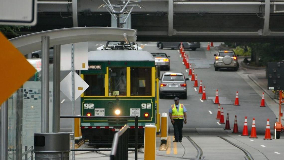 A Gold Line streetcar driver moves from one end to the other as he prepares to head in the opposite direction on East 4th Street Thursday, June 22, 2017. Catch On Seafood Market, on Hawthorne Lane, is closed now, the result, its owner says, of construction.