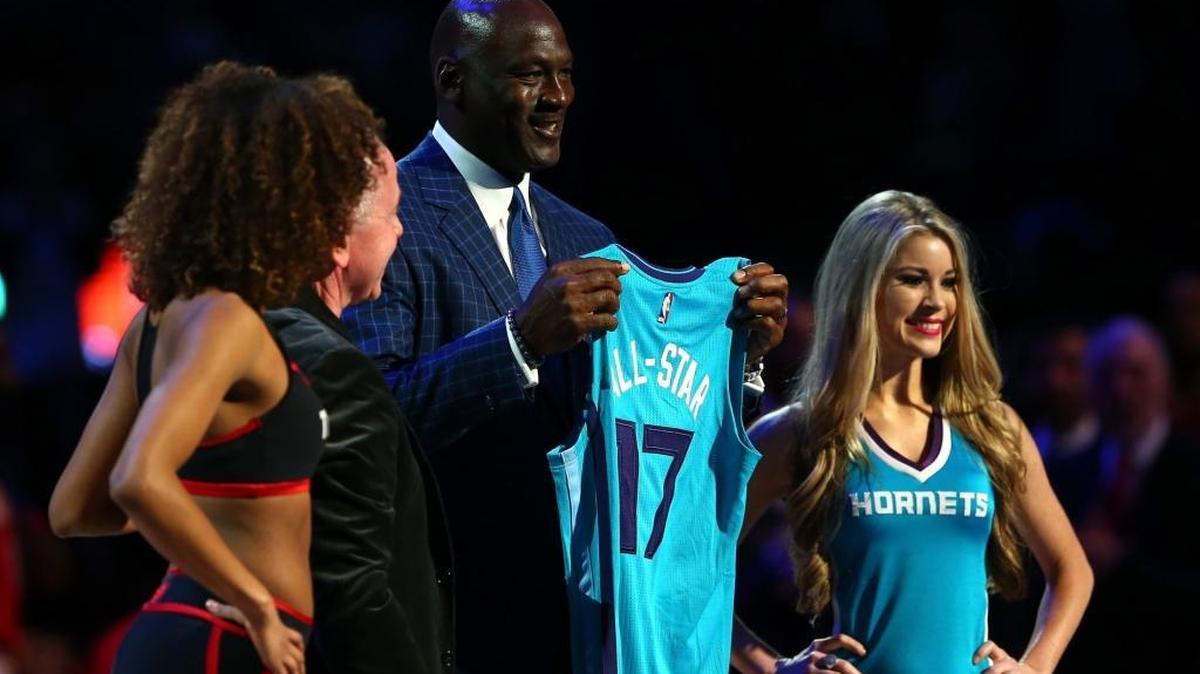Larry Tanenbaum presents NBA Hall of Famer and Charlotte Hornets owner Michael Jordan a jersey signifying Charlotte as the host city for the 2017 All-Star game during the NBA All-Star Game 2016 at the Air Canada Centre on February 14, 2016 in Toronto, Ontario.