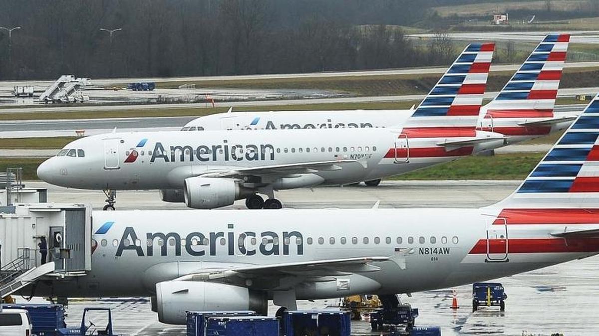 American Airlines jets pull into the terminal at Charlotte Douglas International airport on Dec. 23, 2015.