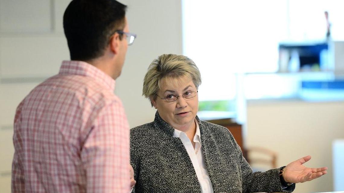 Sherry Chisenhall, who started this month as editor of The Charlotte Observer, discusses coverage with Ronnie Glassberg, an editor on the metro desk.