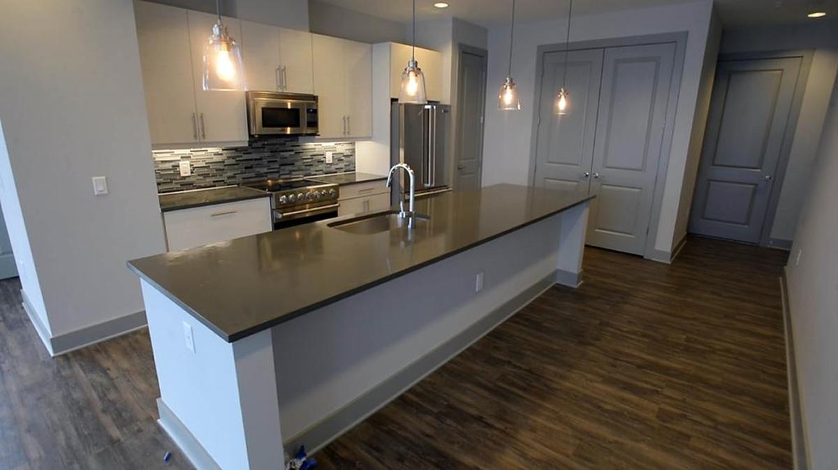 A view of the kitchen in a penthouse unit in Museum Tower on Tuesday, June 20, 2017. Museum Tower, developed by Childress Klein, totals 394 apartments atop the Mint Museum.