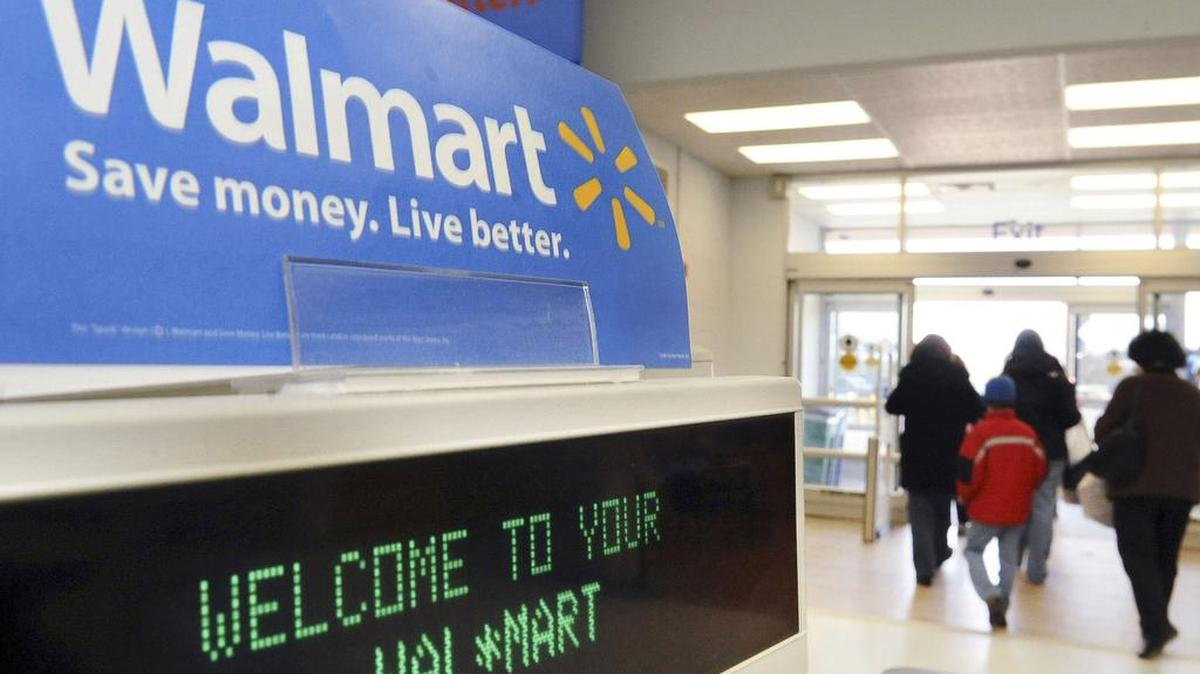 
Shoppers leave a Wal-Mart in Danvers, Mass. When Wal-Mart Stores Inc. chief Doug McMillon announced plans to boost store workers’ minimum wage earlier this year, he said the move was intended to improve morale and retain employees. Yet for some of the hundreds of thousands of workers getting no raise, the policy is having the opposite effect.
