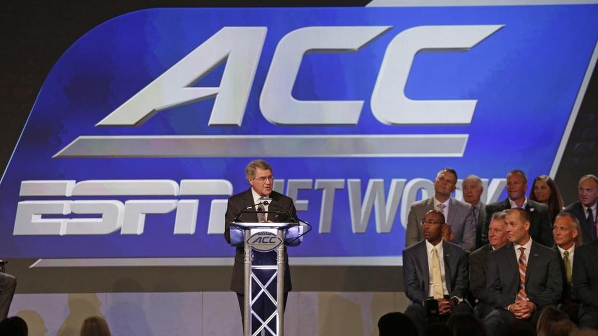 Commissioner John Swofford, center, announces an ACC/ESPN Network during a news conference at the Atlantic Coast Conference Football Kickoff in Charlotte, N.C., Thursday, July 21, 2016.