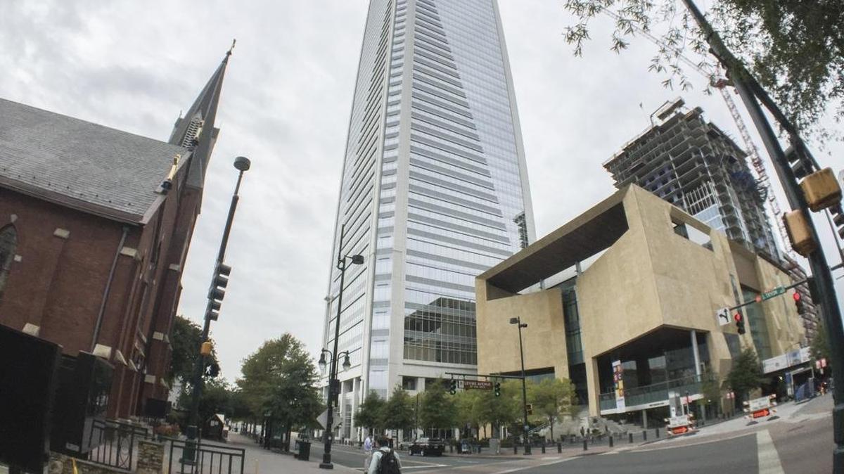 The Duke Energy Center towers over an uptown Charlotte street.