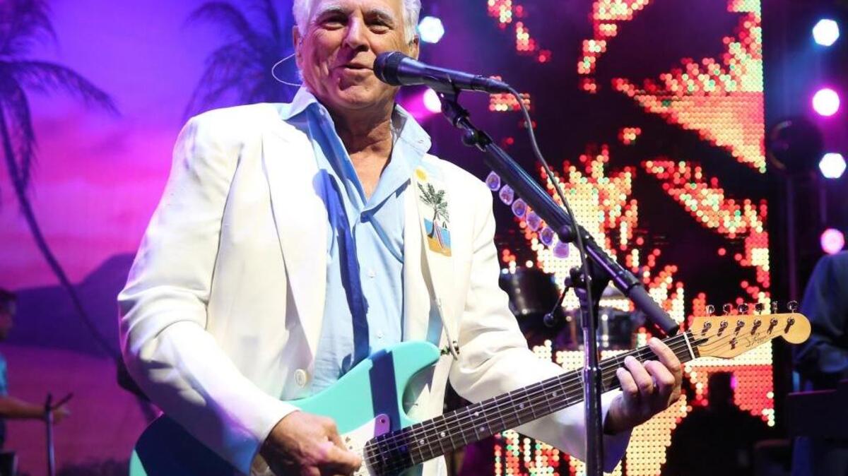 In this June 9, 2015 file photo, Jimmy Buffett performs at the after party for the premiere of “Jurassic World” in Los Angeles. The singer said he will still play in Charlotte and Raleigh despite his opposition to North Carolina’s new LGBT law, which limits the legal protections of LGBT individuals.