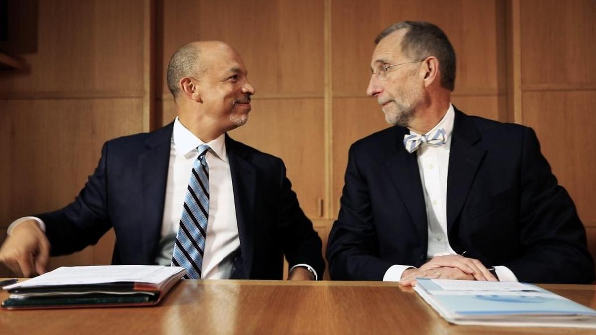 Carolina HealthCare System CEO Gene Woods, left, and UNC Health Care CEO William Roper discuss plans to form a joint operating company with reporters in this August 2017 file photo.