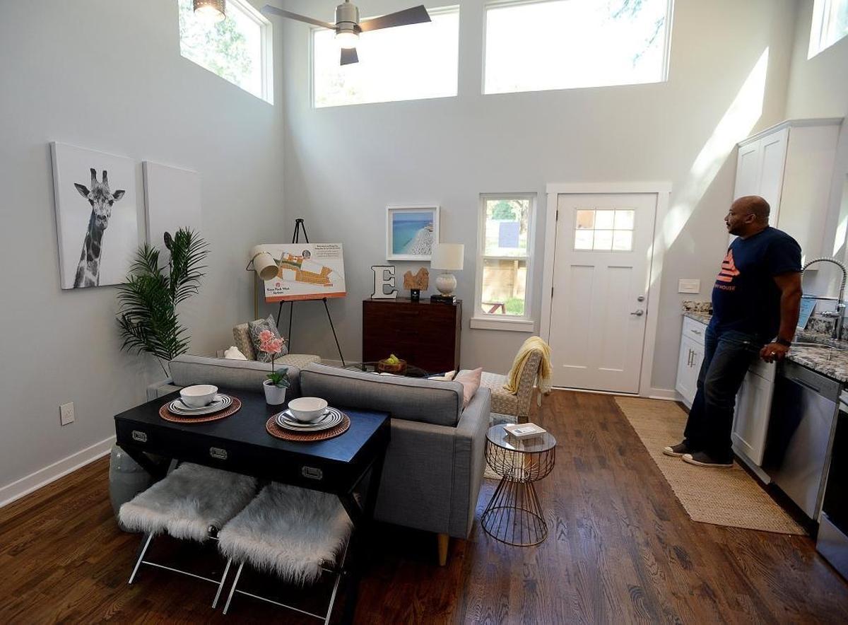 Developer Kelvin Young surveys the model tiny house at the planned Keyo Park West development in Coulwood on Cathey Road. At 500 square feet, the house sold for $92,000, but an attorney for Young said the plans are no longer moving forward.