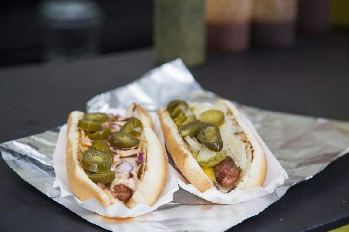 Ideas for many of the hotdogs on Chili Man’s menu come from customers, such as the “Backside Disaster,” right, and the “Vinegar Bomb,” shown here in 2015. 