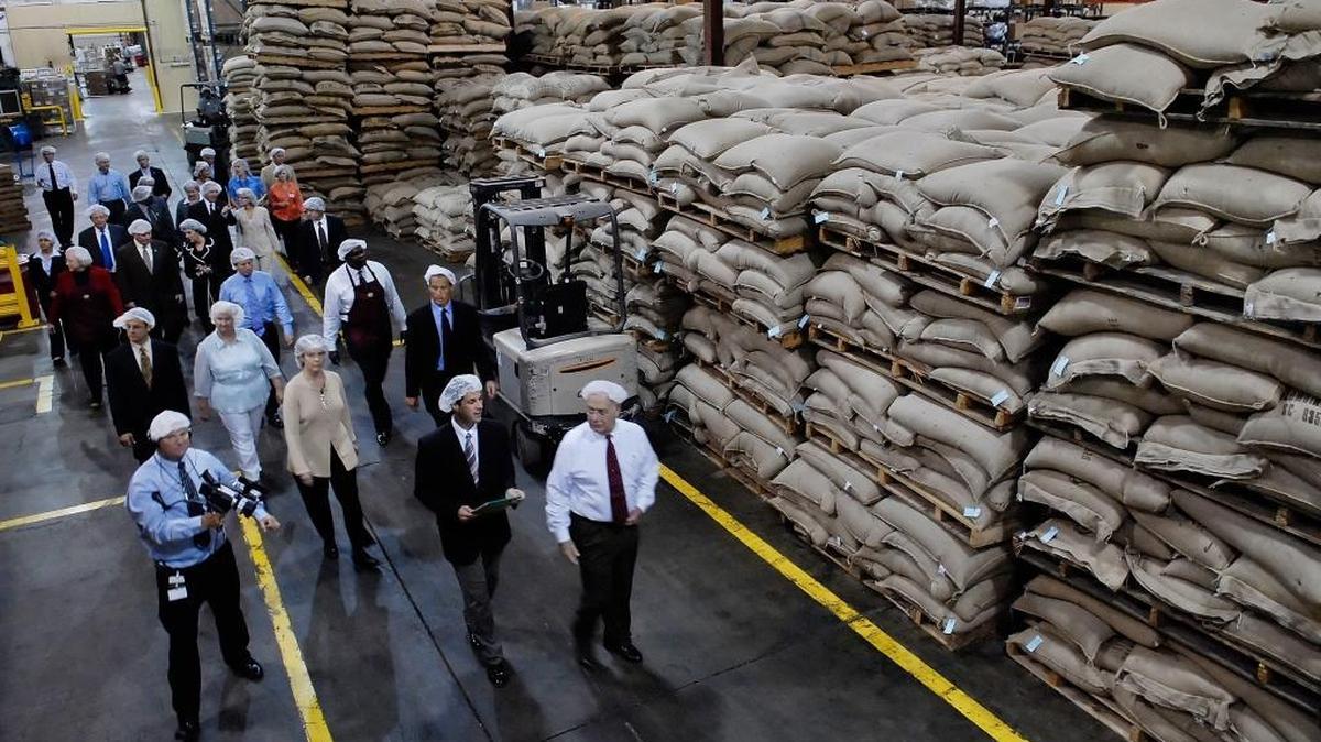 Executives lead a tour of the S&D Coffee facilities in Concord for McDonald’s executives in a 2008 file photo. S&D was sold for $405 million last week.