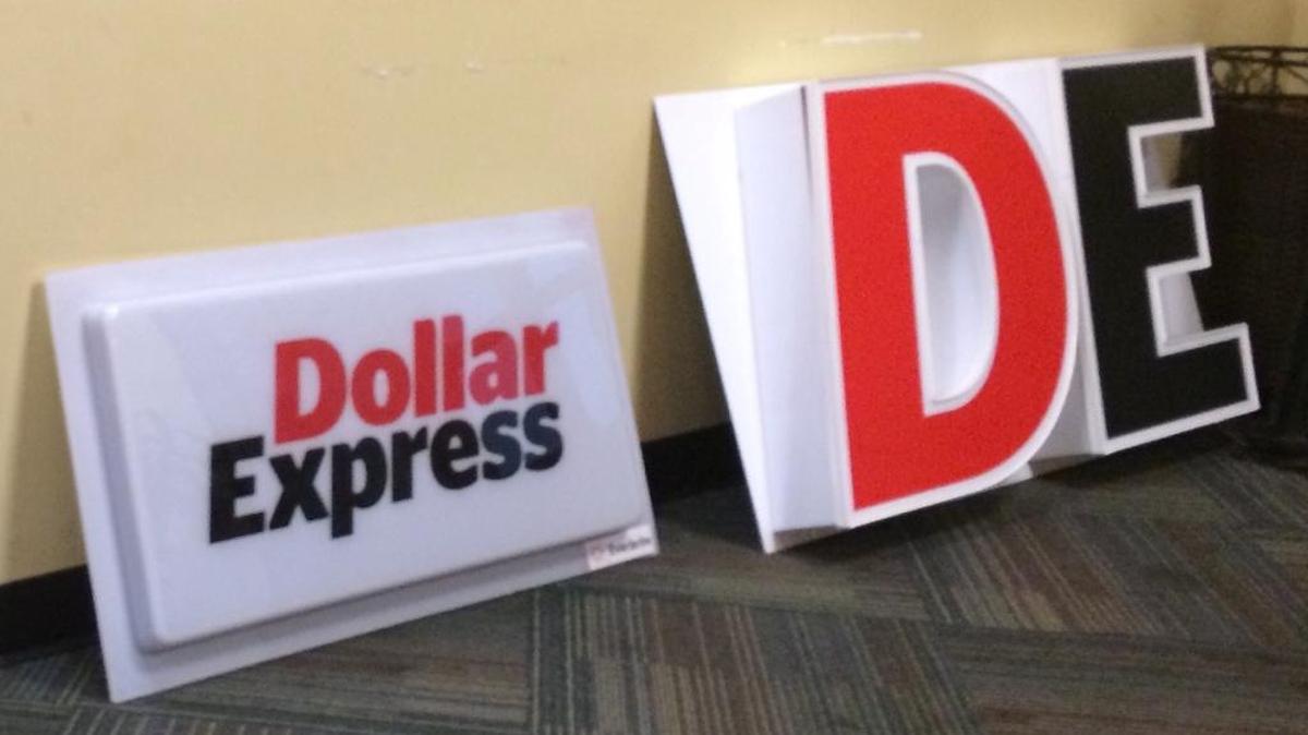 Dollar Express signs are on display at the company’s headquarters off Independence Boulevard.