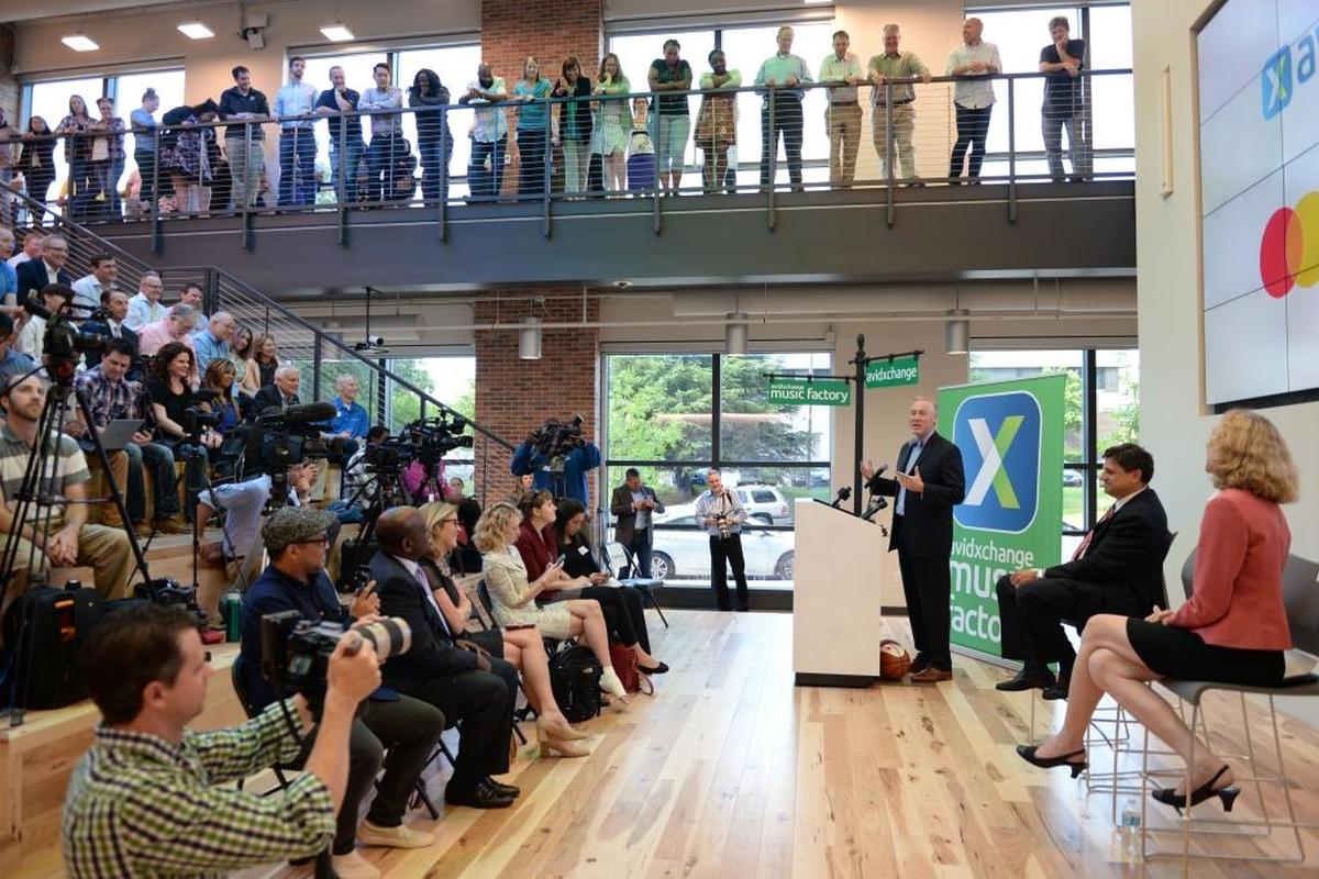 Richard Crum, the SVP of New Product Development at MasterCard, speaks at a press conference in AvidXchange's new location on Thursday, June 8.