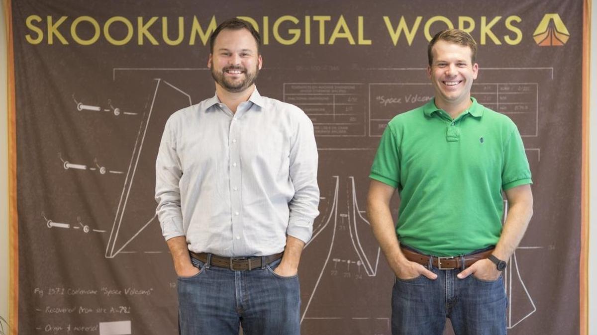 Skookum CEO James Hartsell (left) and chief people officer Andrew Gertig at the web and app developer’s uptown office. The company ranked No. 1 among small companies in the 2016 Top Workplaces survey.