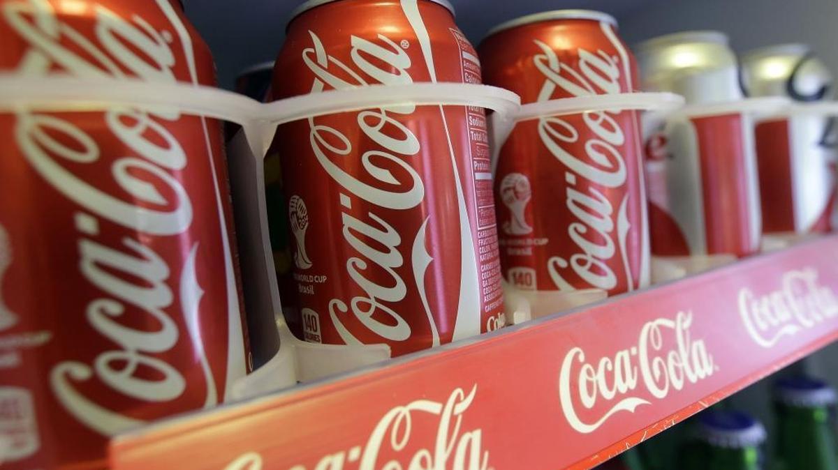 
This June 30, 2014 file photo shows cans of Coca-Cola in the refrigerator of Chile Lindo in San Francisco. 
