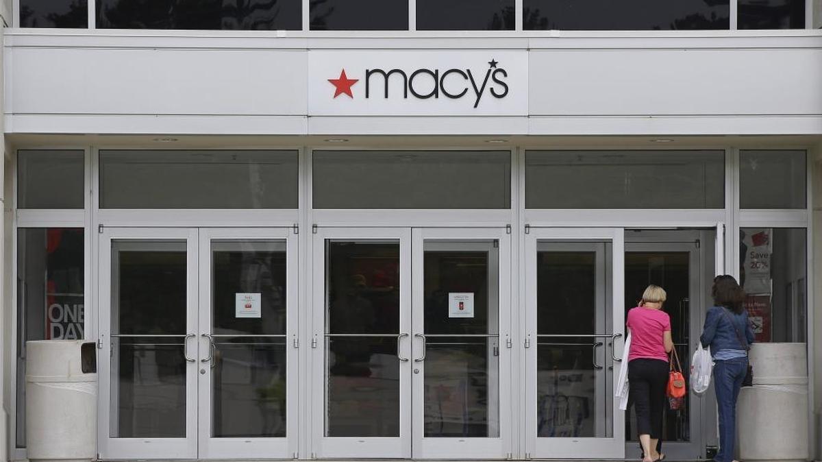 In this July 10, 2015, file photo, shoppers walk into a Macy's department store at the Hanover Mall in Hanover, Mass. Macy's is cutting up to about 4,800 jobs after disappointing holiday sales. The company also listed Wednesday, Jan. 6, 2016, which 40 stores it would close. It had announced it was closing stores in September. (AP Photo/Stephan Savoia, File)