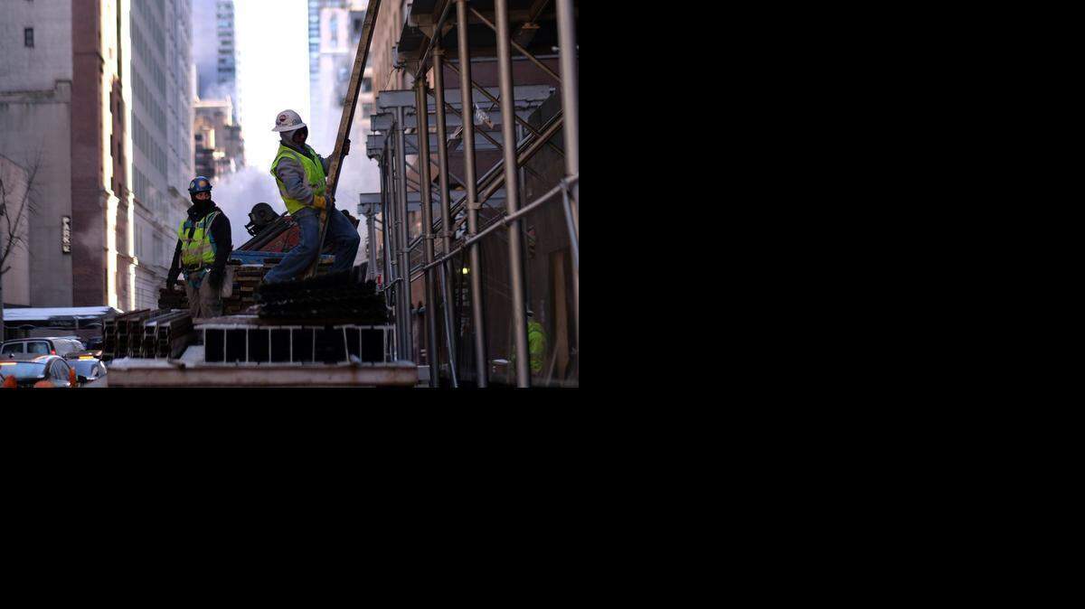 
Laborers work at a building site in New York. The US economy pumped out a strong 295,000 net new jobs in February despite some severe weather disruptions and mounting layoffs in the oil industry, the Labor Department reported March 6, 2015. The better-than-expected jobs number sent the unemployment rate down to 5.5 percent, from 5.7 percent previously and the lowest level since May 2008. Hiring was strong in restaurants, health care, and administrative services, and steady in construction and retail trade. AFP PHOTO/JEWEL SAMADJEWEL SAMAD/AFP/Getty Images
