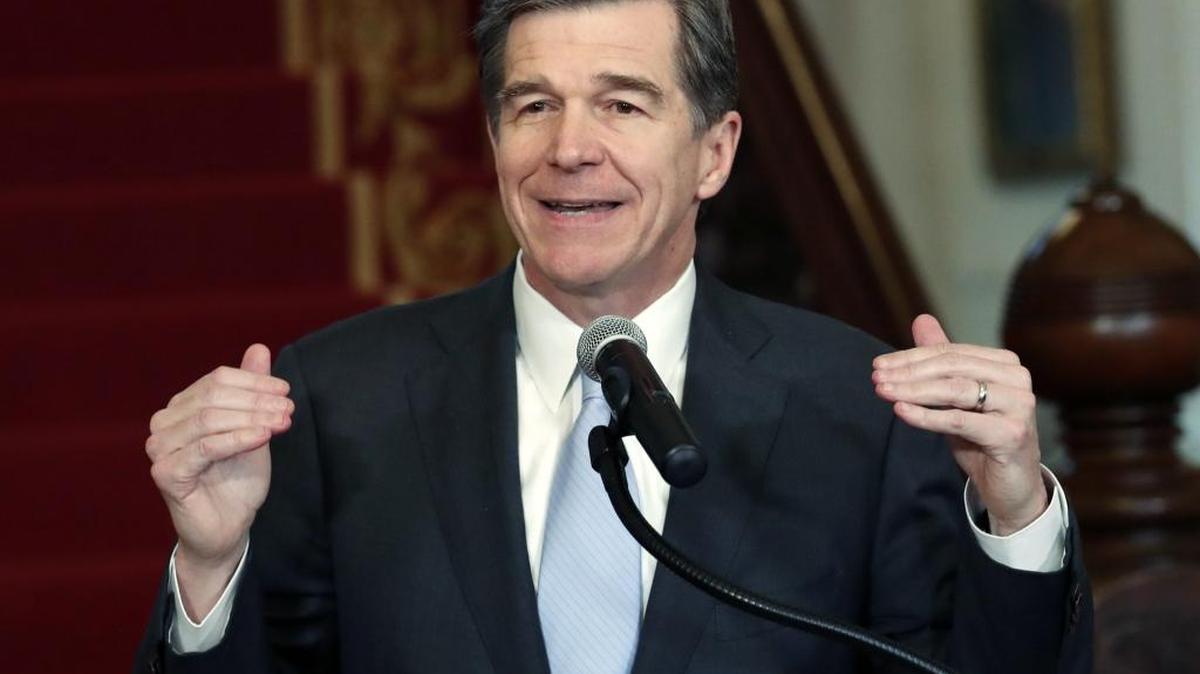 North Carolina Gov. Roy Cooper holds a press conference at the Executive Mansion in Raleigh Thursday to announce that he signed a HB142, a compromise replacement bill for HB2, that the N.C. General Assembly passed earlier in the day.