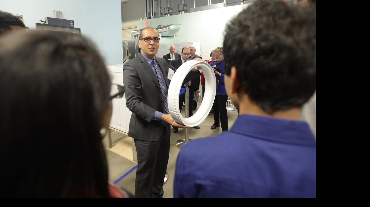 
Flavio Bernindino discusses washer and dryer technology during a 2014 tour of Swedish appliance-maker Electrolux's research and development facility in Charlotte. On Wednesday, a professor at Johns Hopkins University said a proposed trade agreement between the U.S. and European Union could result in more business between Charlotte and European countries.
