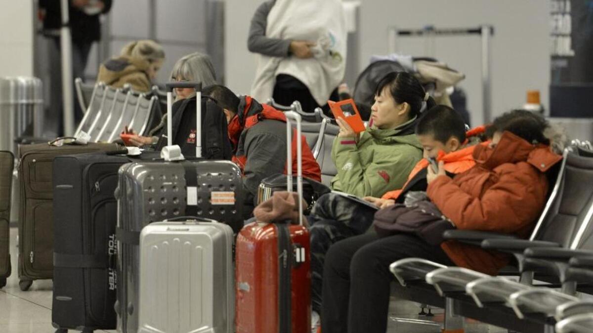 Travelers at Charlotte Douglas International Airport early Tuesday morning, Feb. 17, 2015.
