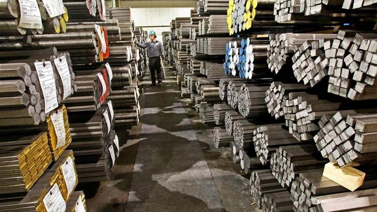 Edwin Garcia, production supervisor, looks over finished orders of steel waiting to be shipped, January 4, 2011, at the Nucor Cold Finish Group plant in Oak Creek, Wisconsin.