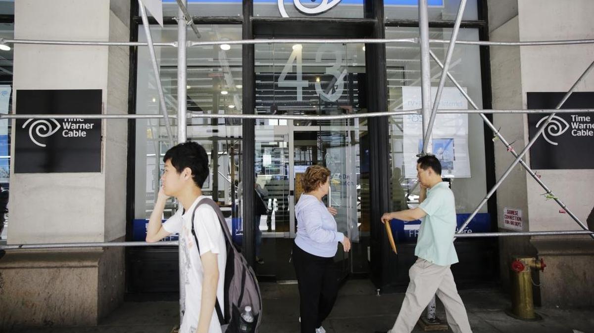 Charter Communications Inc. won U.S. antitrust approval for its $55 billion takeover of Time Warner Cable Inc., which would create the No. 2 U.S. cable provider, after agreeing to measures intended to protect distribution of online video.