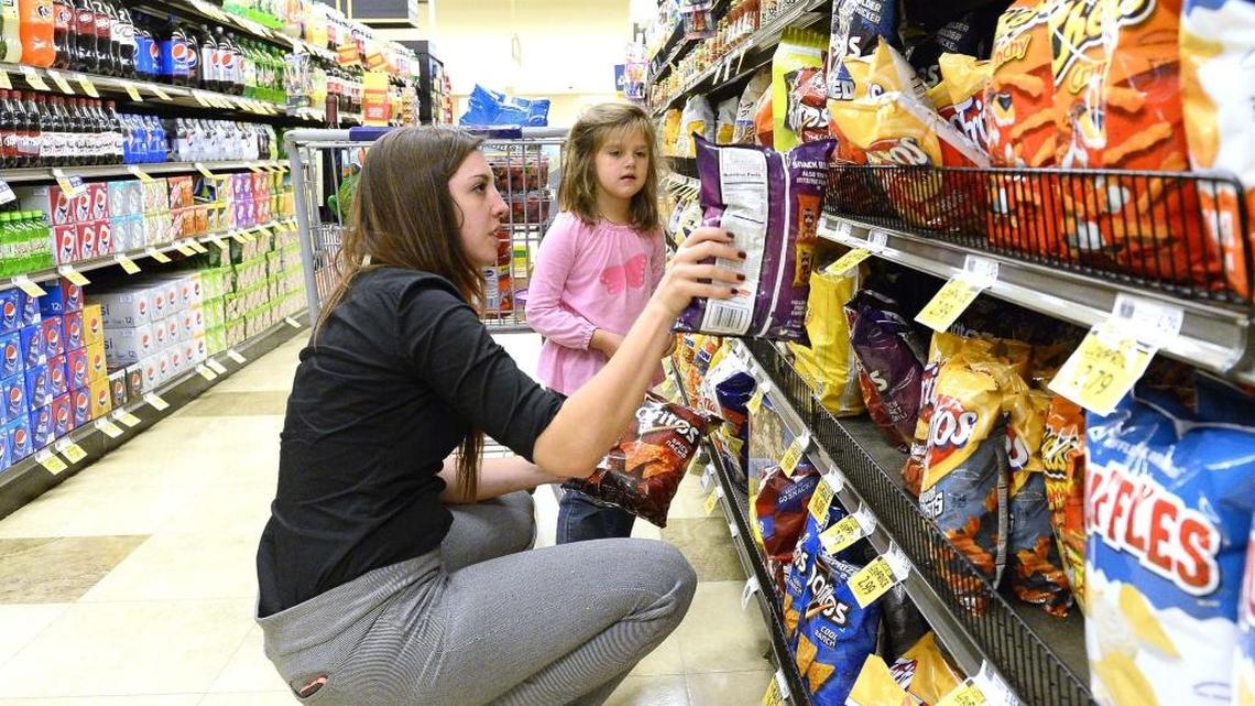 Amanda Marion and her 4-year-old daughter Adelynn Marion shop together at the Park Road Food Lion in Dilworth on April 07, 2016.