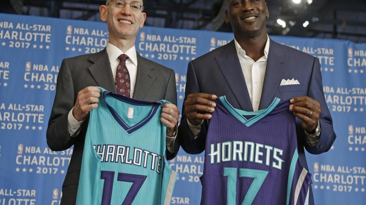 NBA commissioner Adam Silver, left, and Charlotte Hornets owner Michael Jordan, right, pose for a photo during a news conference to announce Charlotte as the site of the 2017 NBA All-Star Game in June of 2015.