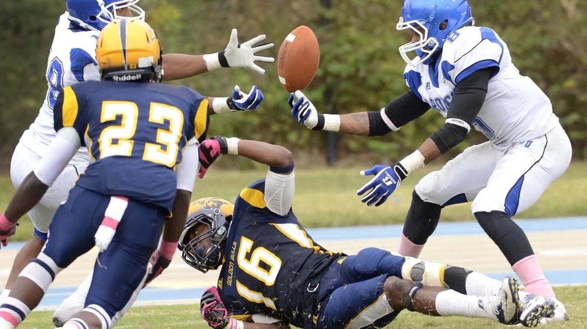 Johnson C. Smith's wide receiver Chris Patterson (16)(center), had a pass broken up by Fayetteville's Michael Johnson (18)(left), Fayetteville's Christopher Person (8)(right), during Saturday's CIAA college football game played at Johnson C. Smith Irwin Belk Complex on Oct. 19. 2013.
